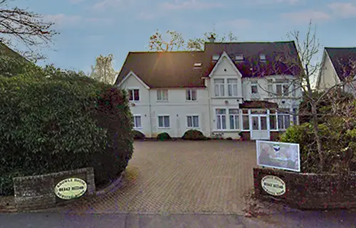 Exterior view of Knowle House care home in East Grinstead